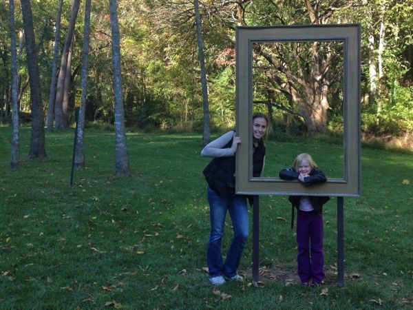 Mom and daughter posing for a photograph