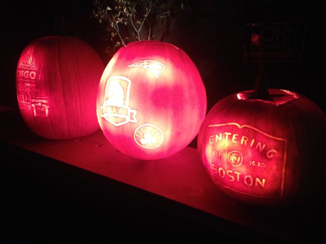 Photo of pumpkins carved with Boston images