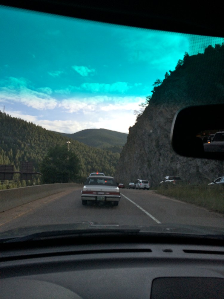 View of mountains through car windsheild