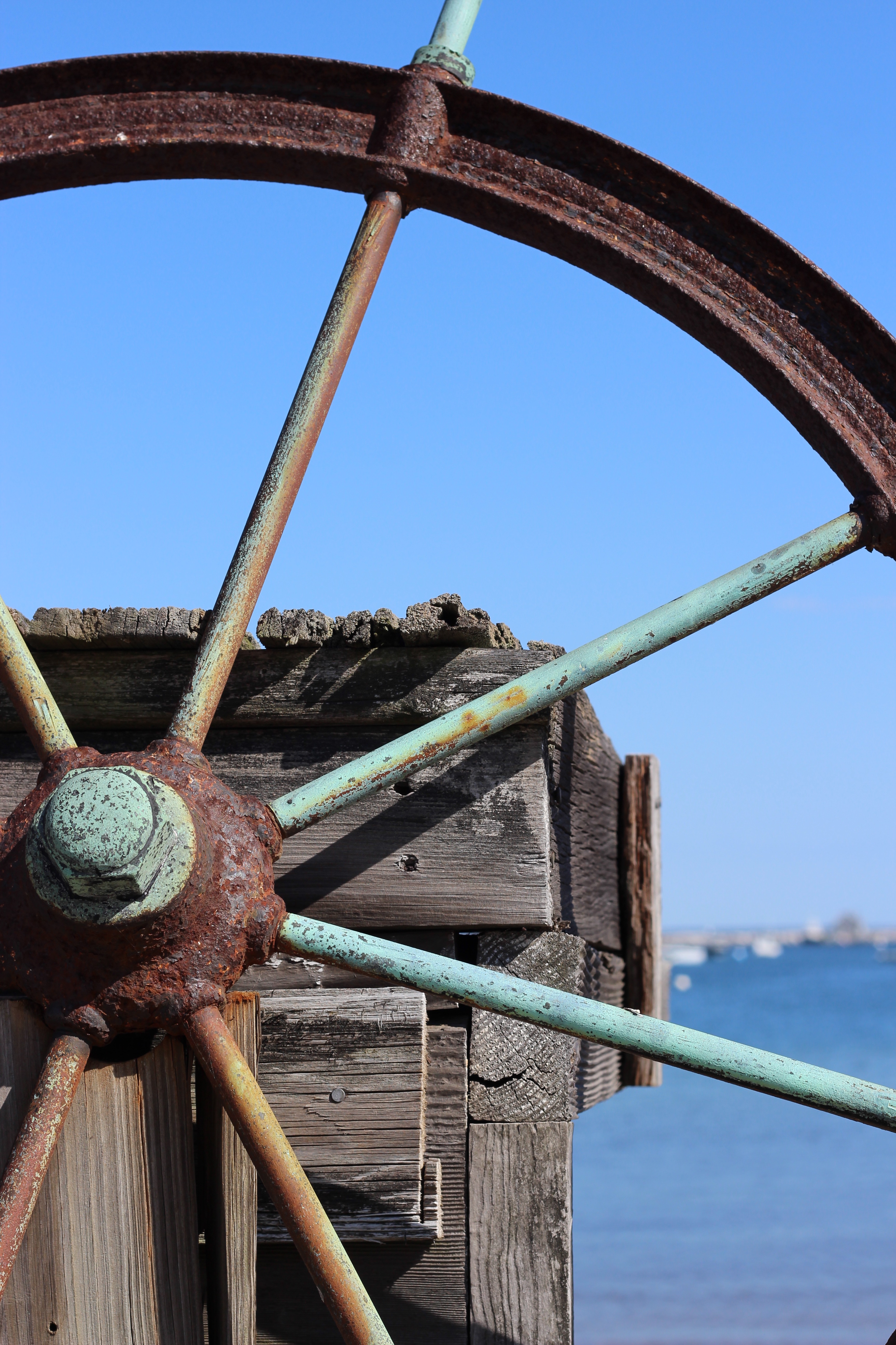 Part of a rusty ship's wheel