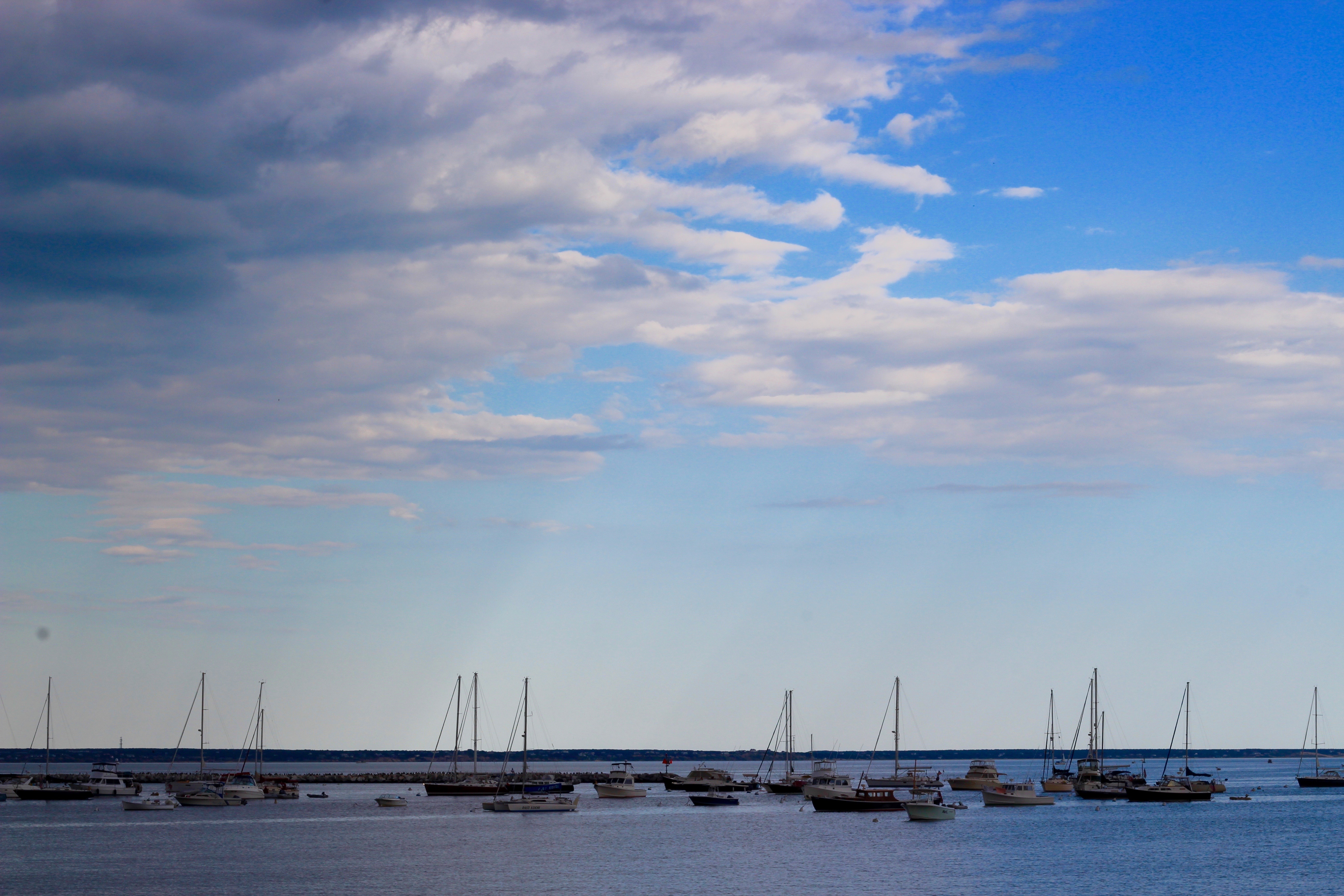 boats on the ocean with pretty sky