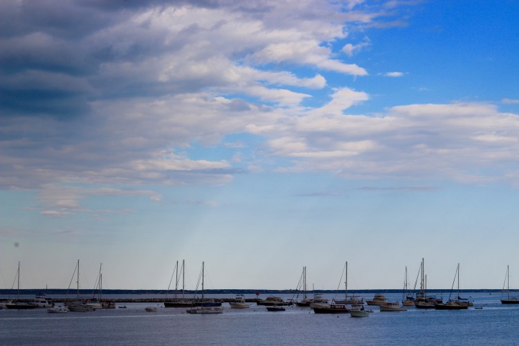 boats on the ocean with pretty sky